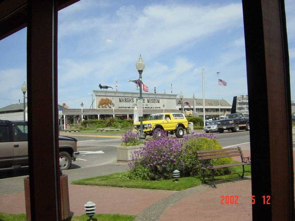 Lifted yellow vintage Ford Bronco parked on the street outside Marsh's Free Museum in Long Beach, WA