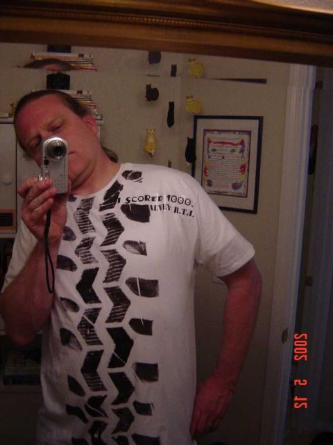1996 Ford Bronco - Man in a t-shirt with a tire tread pattern takes a selfie in a mirror, with a timestamp of 2005.