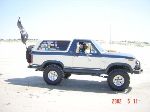 1996 Ford Bronco - This lifted Ford Bronco is equipped with off-road tires and a spare tire mounted on the rear tailgate.