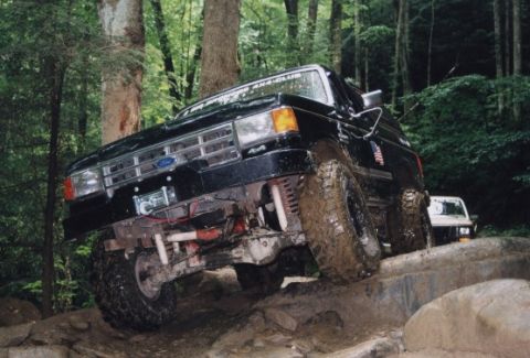 1987 Ford Bronco - A little closer to the crunch. I think my spotter Adam learned from this. The next day we crossed the same spot, but w/o the body damage.
