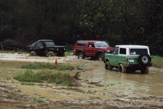 Next we drive around to a king-size 'mud puddle'.  Doc, Jason, & Morris.