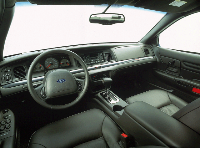 Black leather Ford Crown Victoria interior with center console shifter and Ford steering wheel