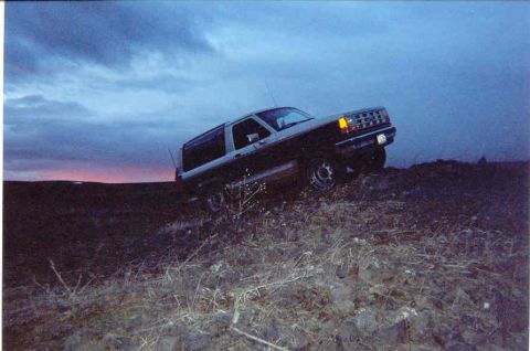 1989 Ford Bronco II - 1989 Ford Bronco II on a hill at dusk.