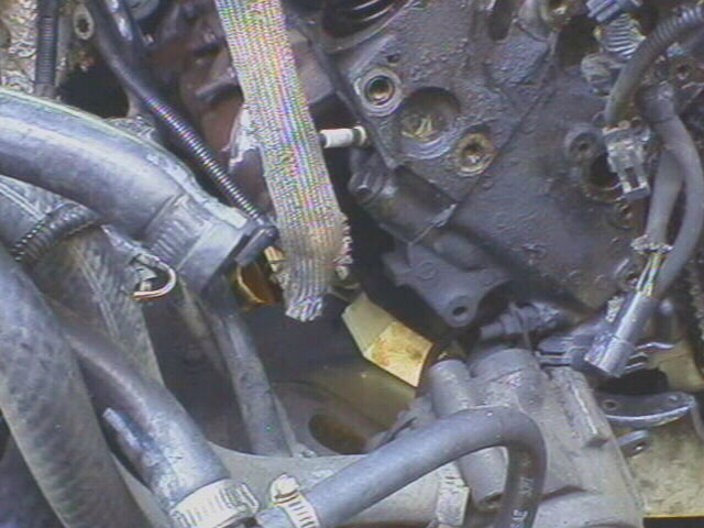 I don't want to risk cracking the tranny tailhousing by lifting any higher. I'll check my other options for oil pan removal...