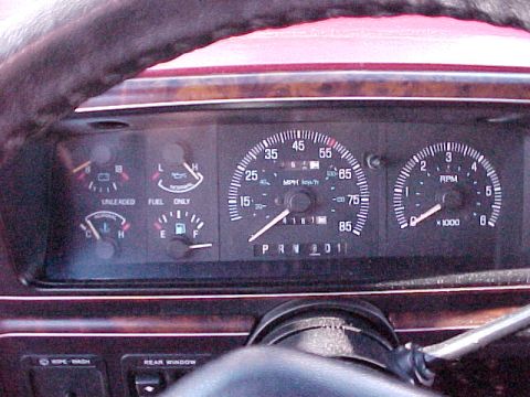 1988 Ford Bronco - Close-up of a vehicle's dashboard, showing the speedometer, tachometer, and fuel gauges.