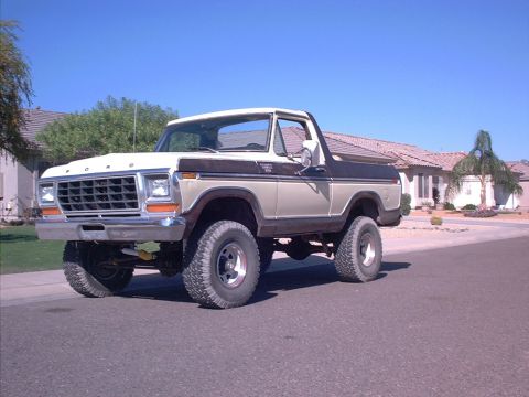 1979 Ford Bronco - This 1979 Ford Bronco features a two-tone tan and brown paint scheme and a prominent front grille.