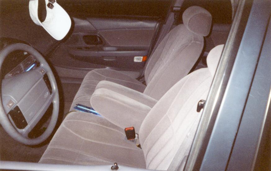Front cloth bucket seats and dashboard interior of a sedan