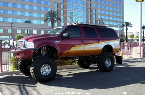 2001 Ford Excursion - This heavily modified 2001 Ford Excursion features a significant lift kit and custom graphics.