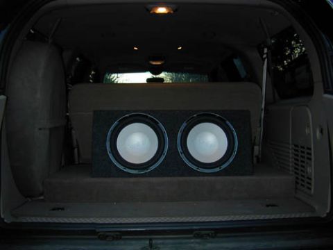 2001 Ford Excursion - My Infinity 12.1 perfect subs sitting on the board that covers my amps. I hope to have the box covered with matching medium parchment carpe…