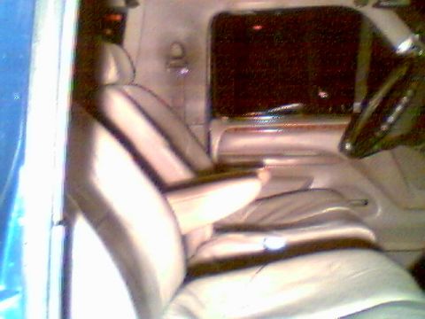 1996 Ford Bronco - Interior view of a 1996 Ford Bronco, highlighting the tan leather seats and dashboard details.