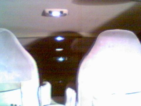 1996 Ford Bronco - Interior view of a vehicle, showing seats and overhead lighting.