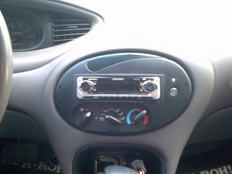 Aftermarket Alpine car stereo installed in a Ford Focus dashboard center