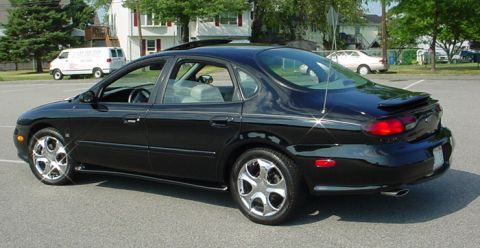 1998 Ford Taurus - 1998 Ford Taurus sedan with a spoiler and sunroof.