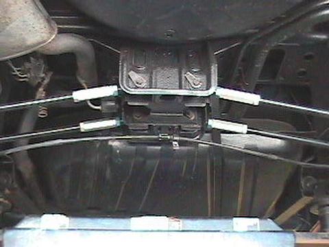 1995 Ford Taurus - Undercarriage view showing suspension parts and exhaust system.