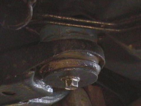 1995 Ford Taurus - Close-up of an unidentified automotive suspension component, taken from below.