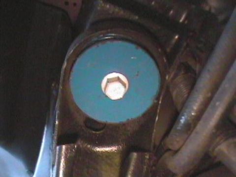 1995 Ford Taurus - Close-up of a blue bushing with a hex bolt, likely a suspension component.