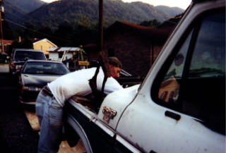 1978 Ford Bronco - Travis helping me unhook stuff off the motor.