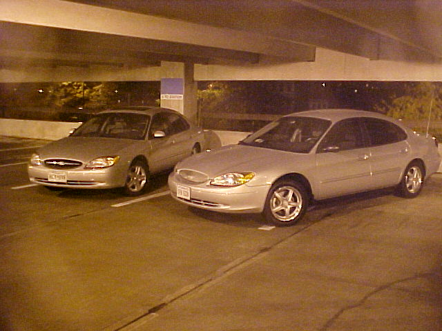 Silver 2001 Ford Taurus parked in a garage, front 3/4 view
