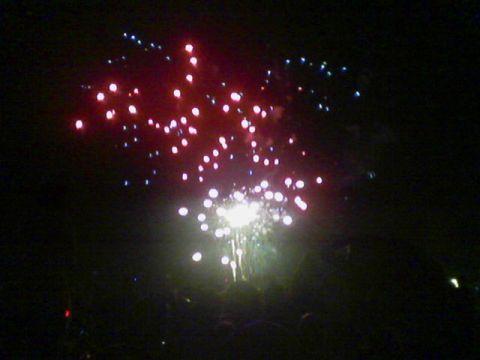 1990 Ford Bronco - A nighttime scene of fireworks illuminating the dark sky with bursts of red, white, and blue light.