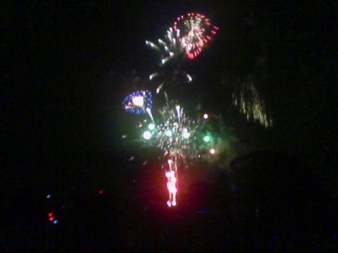 1990 Ford Bronco - A vibrant fireworks display lights up the night sky with bursts of color.