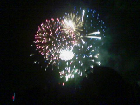 1990 Ford Bronco - A fireworks display lights up the dark sky with multiple bursts of color.