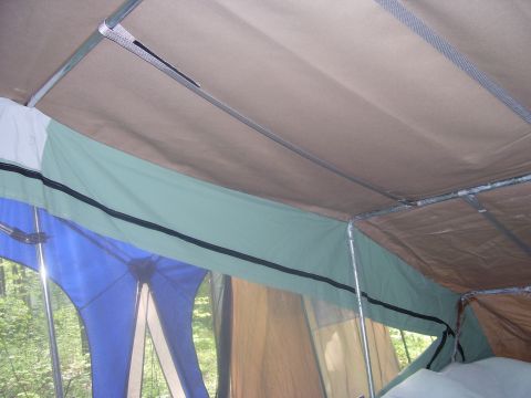 1991 Ford Bronco - Inside a pop-up camper tent showing the canvas structure and support poles.