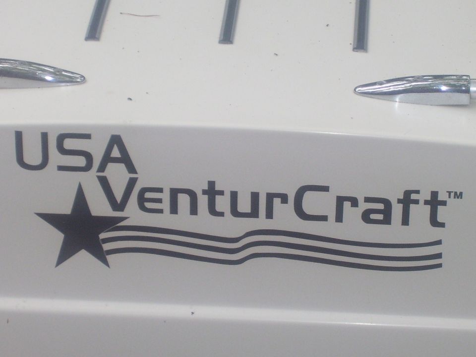 USA VenturCraft star-and-stripes decal on a white fiberglass panel with chrome trim