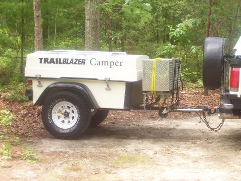1991 Ford Bronco - A white 'TRAILBLAZER Camper' off-road trailer shown in side profile, featuring a single silver spoke wheel with Firestone tire, a front dia…