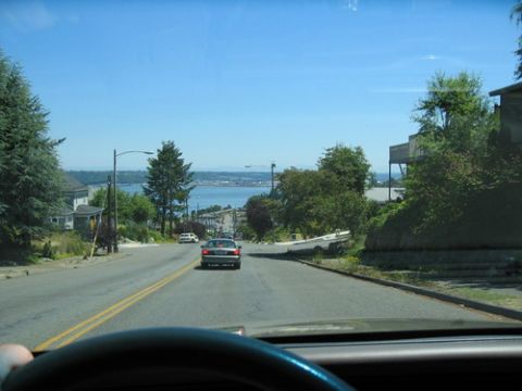 1999 Ford Crown Victoria - Driving down a residential street towards a scenic view of a bay and distant land.