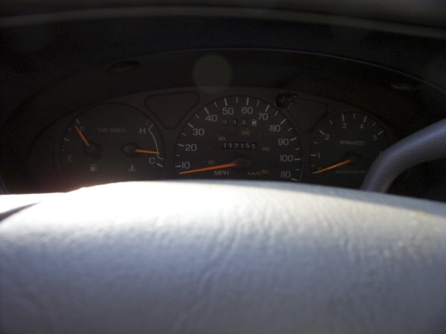 Vehicle instrument cluster showing speedometer, tach and 117756 odometer
