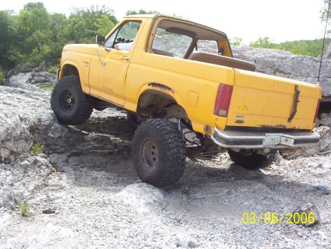 1991 Ford Bronco - Yellow 1991 Ford Bronco navigating rocky terrain. Photo dated 03/05/2006.