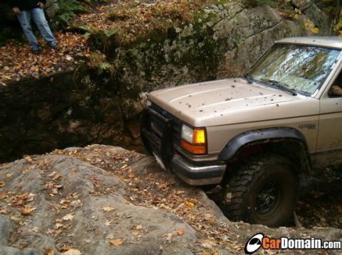 1990 Ford Ranger - This 1990 Ford Ranger navigates a challenging rocky trail, demonstrating its off-road capabilities.
