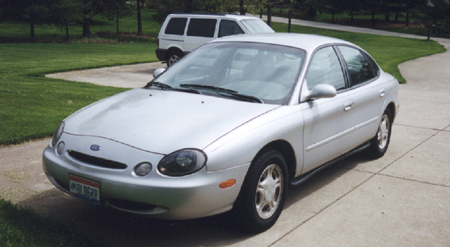 1997 Ford Taurus - This silver sedan's body style suggests a 1996 model year, not the claimed 1997.