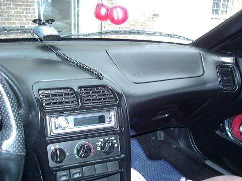1995 Ford Probe - The interior dashboard of a 1995 Ford Probe, an aftermarket stereo and climate controls.