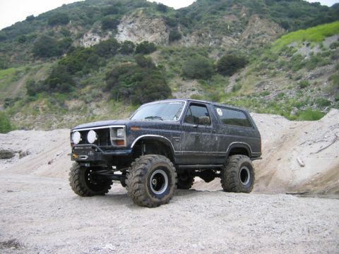 1985 Ford Bronco - This modified Ford Bronco is equipped for off-road adventures, a raised suspension and aggressive tires.