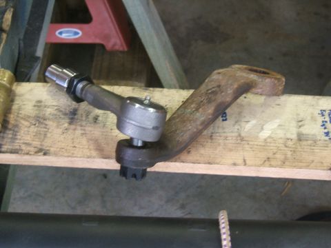 1993 Ford Bronco - Close-up of a steering linkage part, likely a tie rod end assembly.