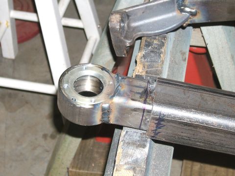 1993 Ford Bronco - A close-up view of a custom-welded metal suspension component, likely for off-road modification.