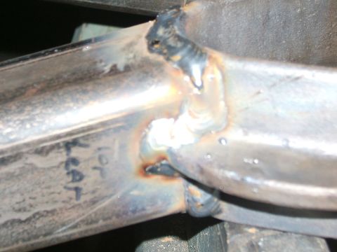 1993 Ford Bronco - This image shows a close-up view of a metal frame with visible welds and handwritten markings.