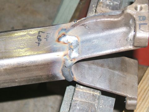 1993 Ford Bronco - Close-up of a welded metal part, possibly from a vehicle's suspension or frame.