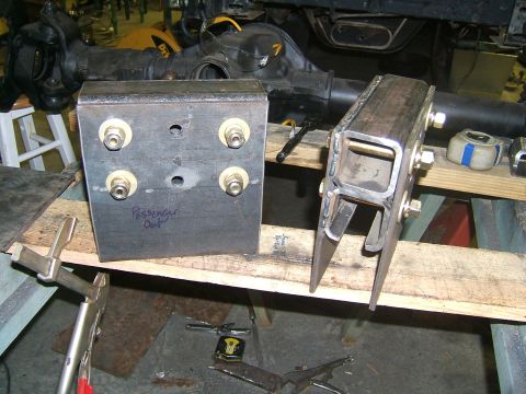 1993 Ford Bronco - Custom fabricated suspension components are laid out on a workbench, ready for installation.