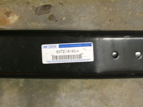 1993 Ford Bronco - A black metal part with a Ford Genuine Parts label showing part number E5TZ-18183-A.