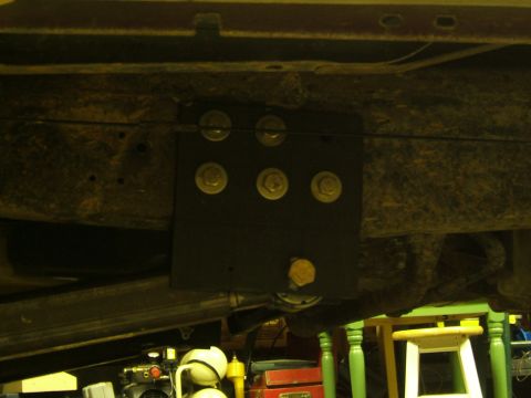 1993 Ford Bronco - This photo shows a close-up of a custom bracket attached to the underside of a vehicle's frame.