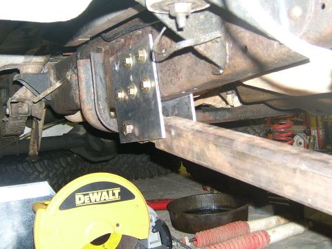 1993 Ford Bronco - Custom suspension work in progress, showing a new bracket and tube attached to the axle.