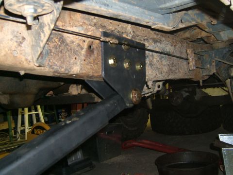 1993 Ford Bronco - Custom suspension bracket installation on a rusty frame, showing modification details.