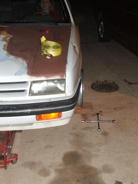 1990 Dodge Shadow - Working on the front end of a 1990 Dodge Shadow with tools laid out.