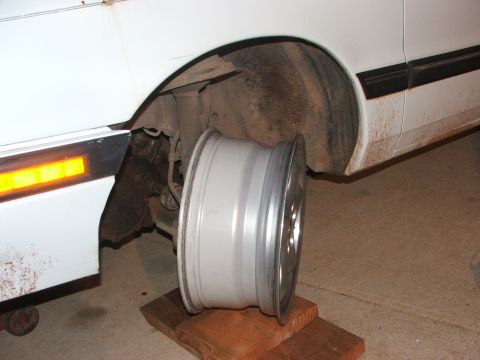 1990 Dodge Shadow - Aftermarket wheel shown near the wheel well of a white vehicle. The registry claims it is a 1990 Dodge Shadow.