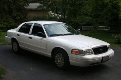2003 Ford Crown Victoria - This 2003 Ford Crown Victoria is captured in a 3q front view, its distinctive grille and headlights.