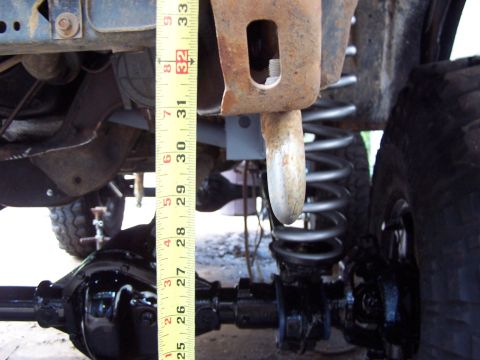 1987 Ford Bronco - Measuring suspension components on a vehicle's rear axle.