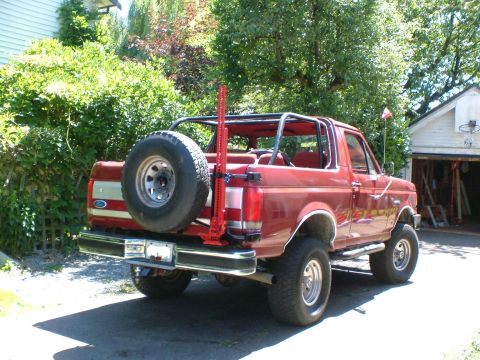1989 Ford Bronco - This 1989 Ford Bronco is shown from the rear, equipped with a spare tire and a Hi-Lift jack mounted on the back.