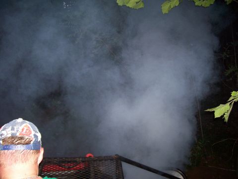 1989 Ford Bronco II - Thick smoke obscures the view of a vehicle, with a person in a hat looking on.
